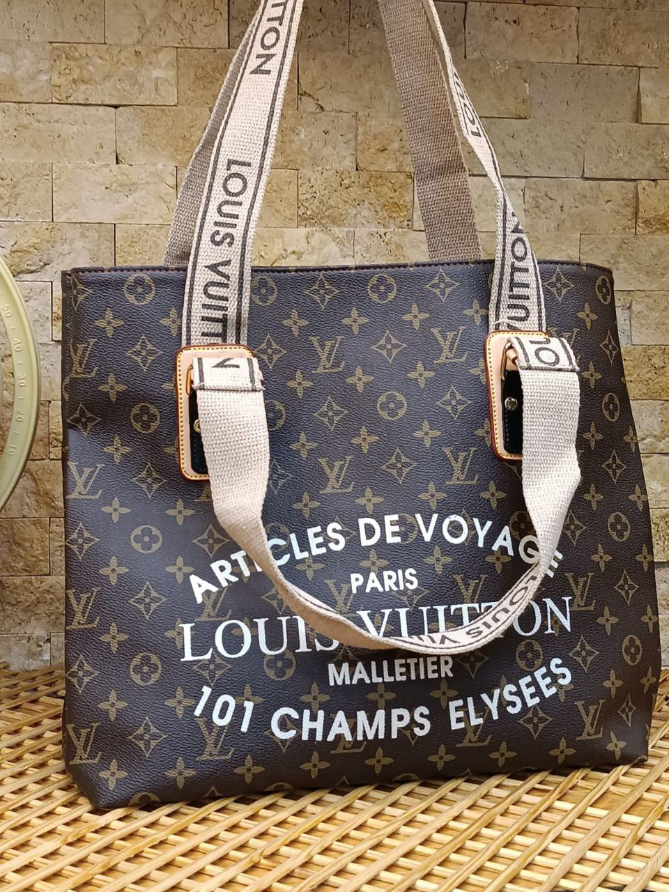 Louis Vuitton Voyage Monogram Tote – Champs Élysées Edition
-LV 71